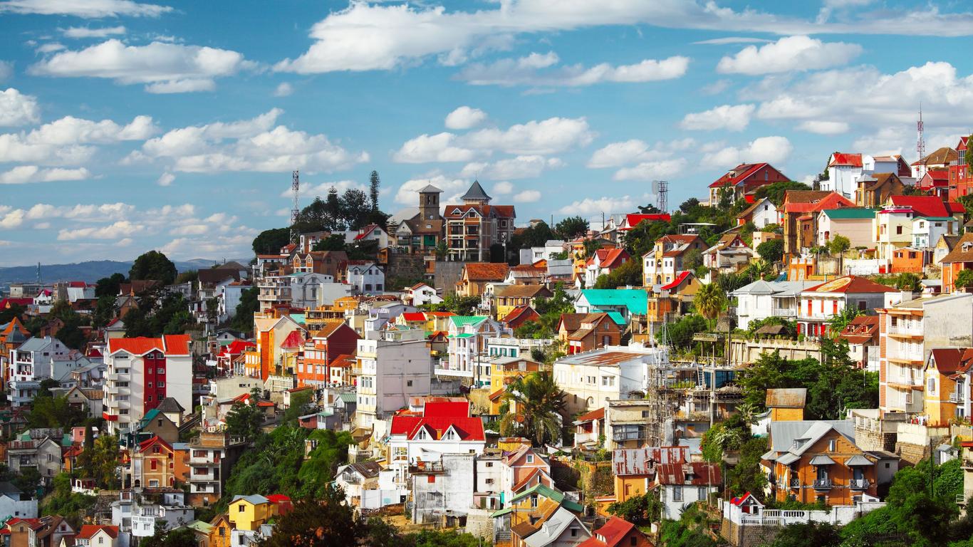 Aerial view of Antananarivo, the capital and largest city of Madagascar, showcasing its hills, colourful buildings, and urban landscape.