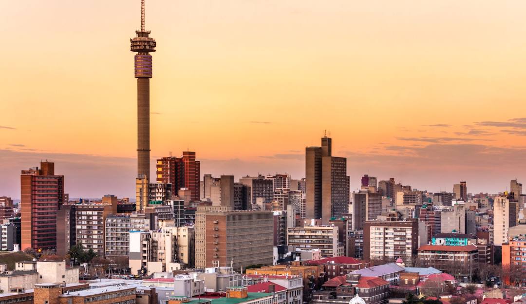 Aerial view of downtown Johannesburg, South Africa, showcasing the city center skyline with high-rise buildings and urban landscapes.